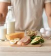 Balanced Nutrition - cropped-view-of-fit-young-guy-standing-near-wholes-2026-03-24-02-18-07-utc
