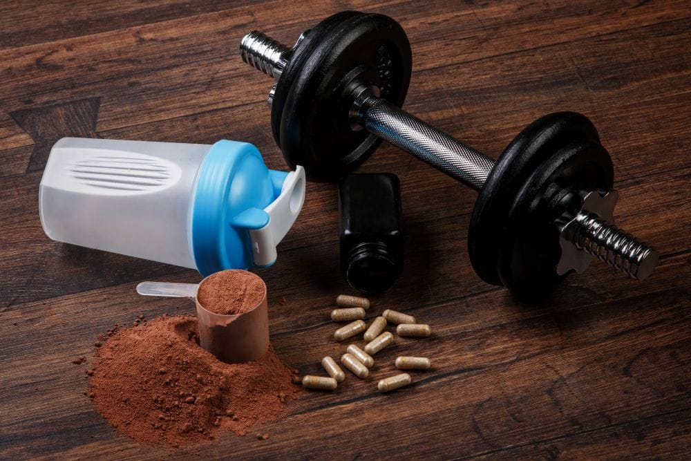 workout-supplements-with-dumbbell-on-wooden-surfac-2026-03-09-23-05-36-utc workout-supplements-with-dumbbell-on-wooden-surfac-2026-03-09-23-05-36-utc