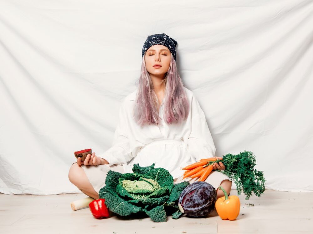 young-woman-meditating-with-vegetables-in-studio-2026-03-09-07-15-51-utc young-woman-meditating-with-vegetables-in-studio-2026-03-09-07-15-51-utc